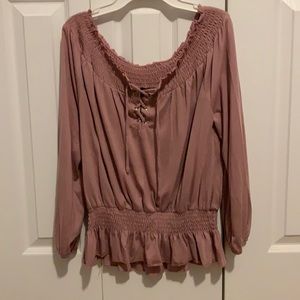 Light pink long sleeve, cinched waist and sleeves, cross in the front